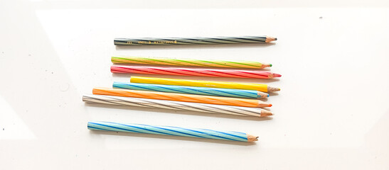 colored pencils on white background