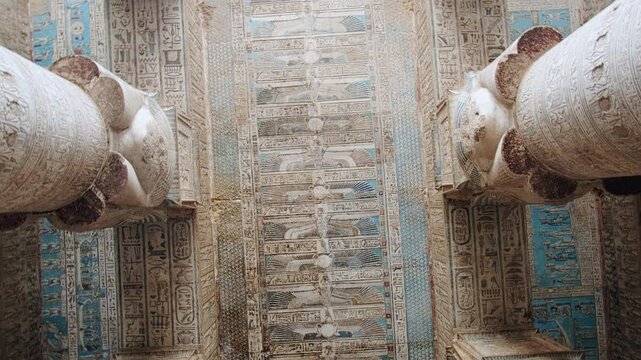 Ceiling of Hypostyle Hall decorated with hieroglyphics and ancient egyptian theme pictures. Temple of Hathor. Dendera Temple complex, Qena, Egypt
