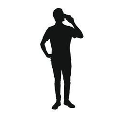 Silhouette of a man drinking water from a bottle
