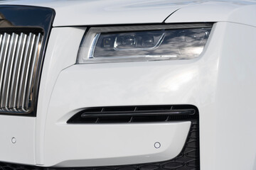 Miami, Florida, USA - December 12, 2024: white Rolls Royce Ghost 2021 sedan car. Luxury sedan car of Rolls Royce Ghost model. Car of Rolls Royce parked outdoor. Rolls Royce, light view.