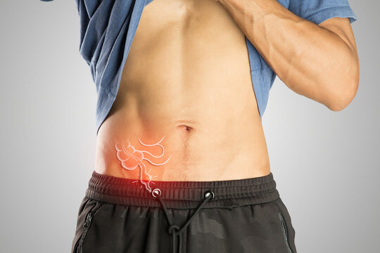 Man on gray background presents stomach ache, key Appendicitis Symptoms highlighted.