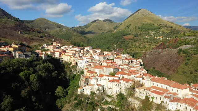 The houses of Tortora on the steep slopes in Europe, Italy, Calabria, in summer, on a sunny day.&nbsp;