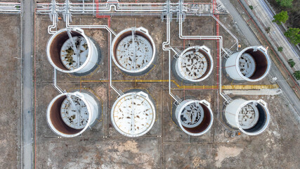 Oil terminal industrial facility storage tank, Oil storage tank with oil terminal port loading arm cargo oil product tanker ship, Global business refinery industry commercial port.