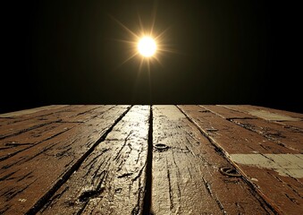 Wooden table top, sun, dark background