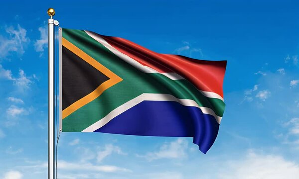 South African flag waving against a clear blue sky.