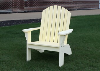 Yellow Adirondack Chair in Grassy Area