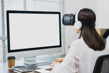 Business woman hand using laptop with VR virtual reality goggles.