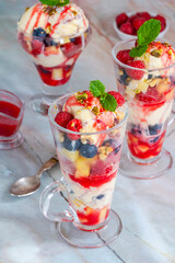 Knickerbocker glory - layered ice cream sundae with fresh fruit
