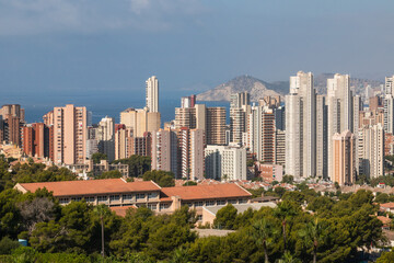 Benidorm skyline dominating the mediterranean coastline in alicante, spain