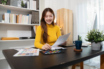 Designer woman thinking ideas strategy about mobile app interface wireframe design with customer...