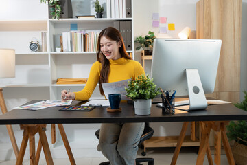 Designer woman thinking ideas strategy about mobile app interface wireframe design with customer...
