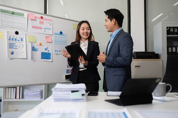 Business documents, data analysis, and teamwork in modern office.