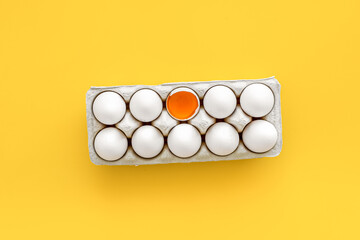Farm products with eggs on yellow background top view