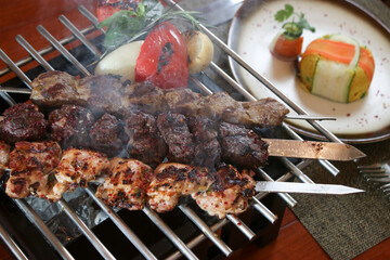 variety of chicken, lamb, and beef kebab on barbecue tray 