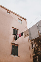 Laundry Hanging on a Peach-Colored Wall