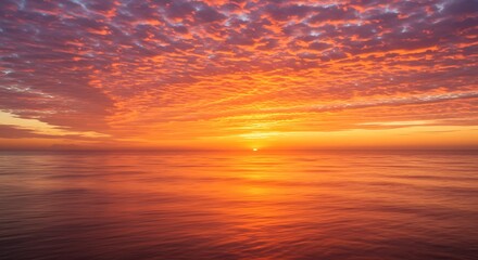 Obraz premium Ocean Sunset with Orange Sky and Water