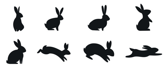 A set of Easter bunnies silhouette in different shapes and actions isolated on a white background.