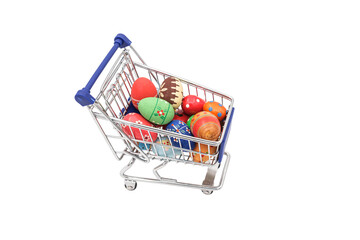 shopping cart full of eggs on white background