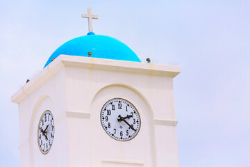 Clock tower of church in Milos island, Greece