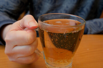 Enjoying a hot beverage on a cozy afternoon