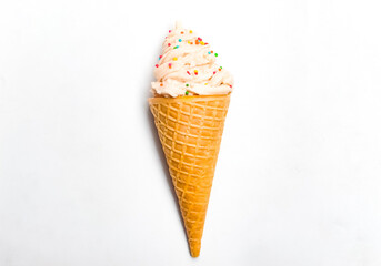 vanilla ice cream cone with sprinkles, isolated on white background