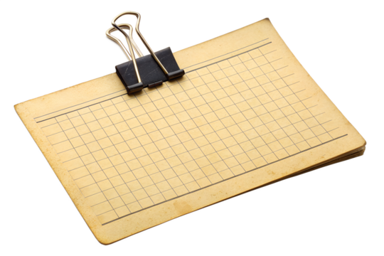A realistic mockup of an old, yellowed notepad sheet with faint grid lines, held together with a metal paper clip. The vintage look adds charm, perfect for retro-themed projects, journaling, scrapbook