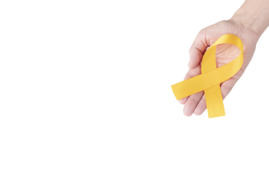 Orange satin ribbon on the palm of a woman, isolated background. Cancer awareness symbol. copy space.