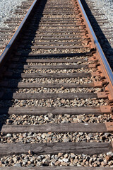 Wooden and Metal Tracks Heading Off