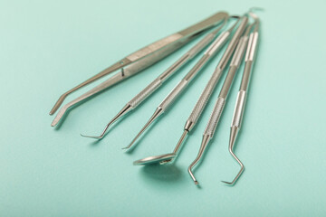 Dentist tools on a blue background. Dentist Concept.Teethcare, dental health concept. Means to care for the oral cavity. Dental model and dental equipment. Dental hygiene. Space for text. Copy space.