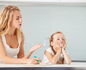 Parent helps the child to do homework