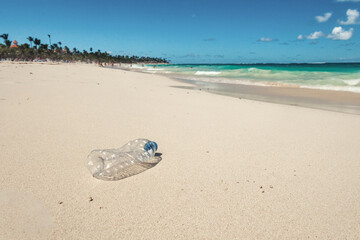 Plastic bottle floating in the Sea in Beach with dirty Coast