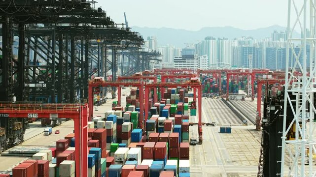 Modern container terminal managing logistics and freight transportation in hong kong, showcasing import and export operations within a dynamic global trade environment. Trade wars, tariffs
