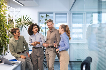 Business team discussing together business plans in office.