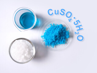 Copper(II) sulfate in Chemical Watch Glass with chemical  formula. Chemical ingredient used in medical and public health issues.