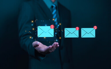 Businessman touching email on virtual screen. New email notification concept for business email...