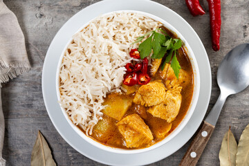 Massaman curry on wooden table. Traditional Thai food recipe