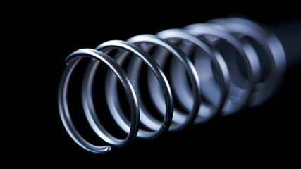 Closeup of coiled metal spring with sufficiently high strength and elastic properties in neon light over dark background. Macro photo, selective focus. Generative AI