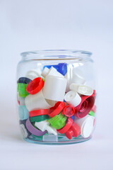 Colorful Plastic Bottle Caps in Glass Jar