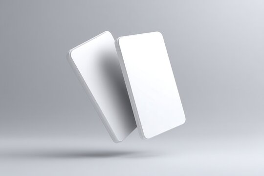 Two Floating Business Cards Mockup: A pristine mockup showcasing two blank business cards levitating gracefully against a neutral gray backdrop.