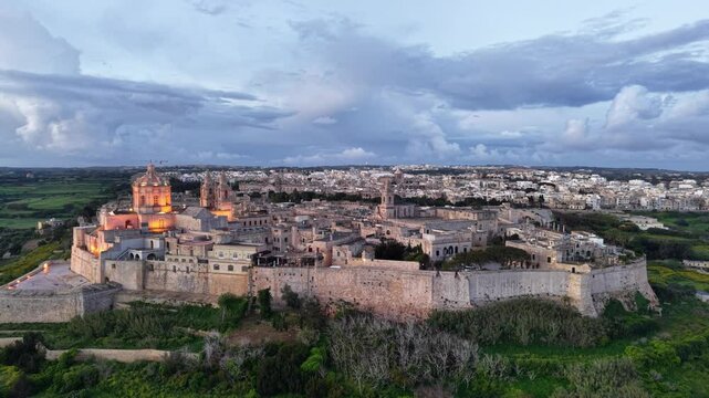 Stunning aerial view of Mdina revealing Malta historical beauty and majestic architecture at dusk