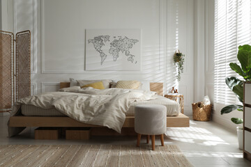 Comfortable bed with soft linens in stylish room. Interior design