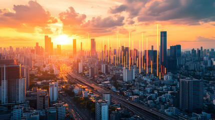 Fototapeta premium Orange and Yellow Sunset Over a City Skyline
