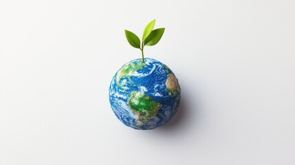 A miniature globe of Earth with a sprout