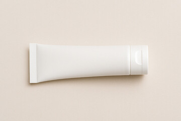 White cosmetic tube mockup on soft neutral background