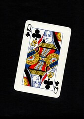 A playing card in the suit of clubs isolated on a black background.