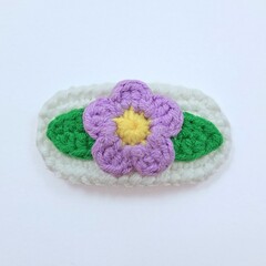 purple flower crochet hairclip on white background