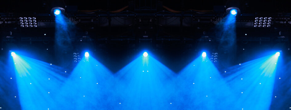 Scene, stage light with colored spotlights. Theater lights spotlights over the stage, texture background for design.	