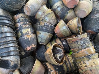 Stack of old wooden items surrounded by natural textures and earthy tones