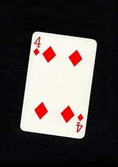 Playing card in the suit of diamonds isolated on a black background.