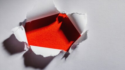 Red and white cut-out paper with hole. A creative concept for art, design or abstract expressions.